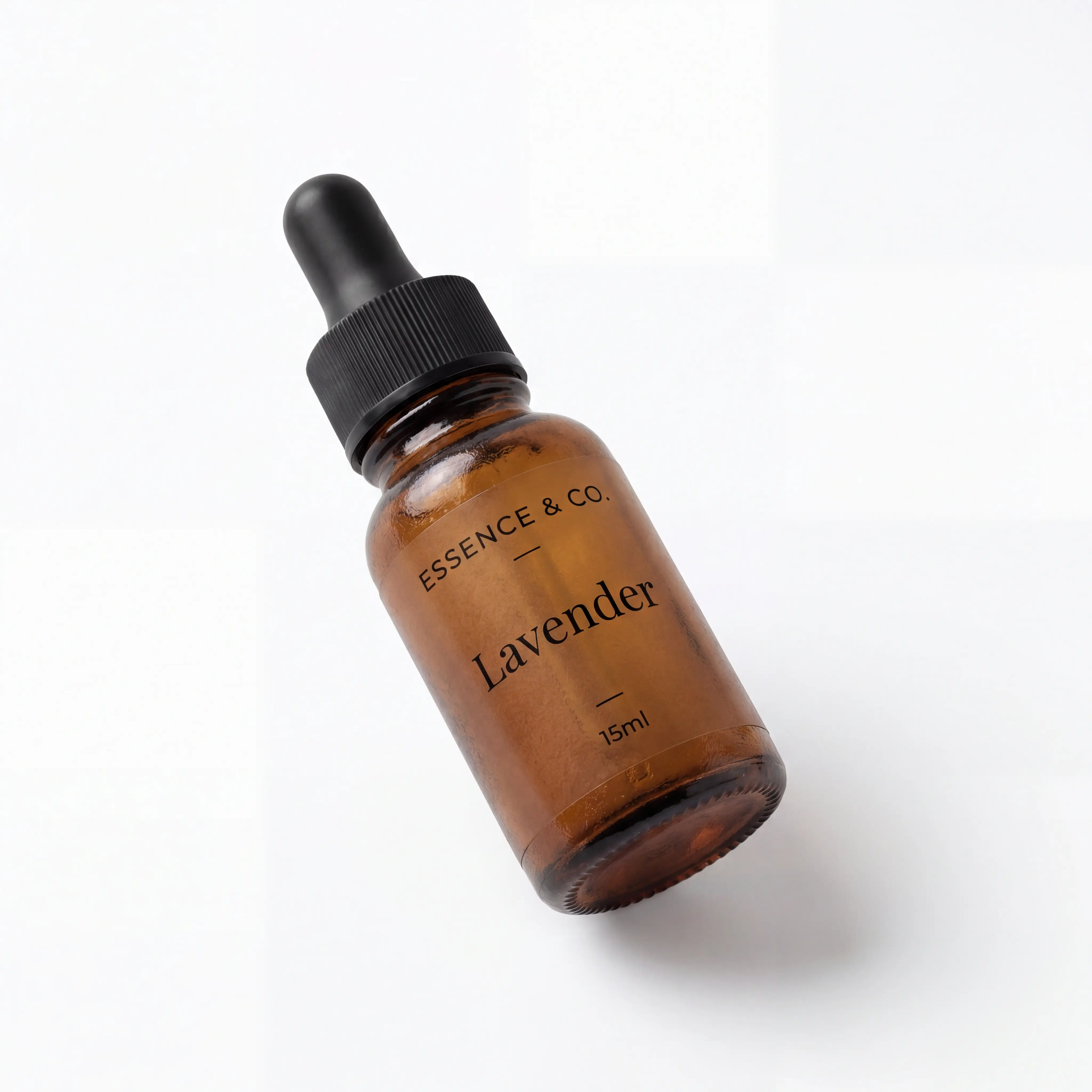 Essence & Co. Lavender 15ml essential oil in an amber glass dropper bottle with a black cap, on a white background.